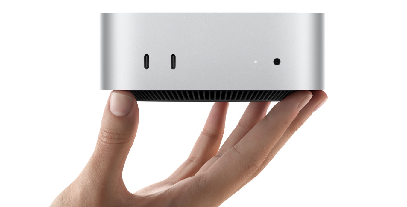 M4 Mac mini held in a hand