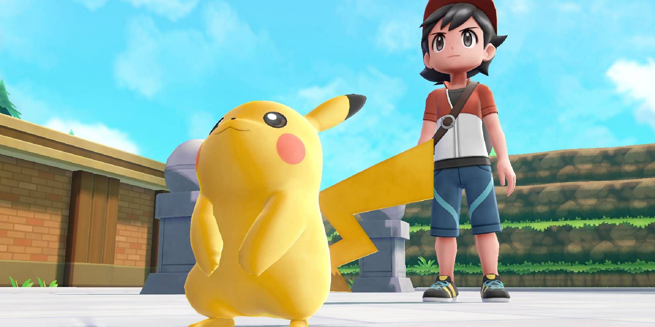 Red and Pikachu ready for battle in Pokemon Let's Go Pikachu.