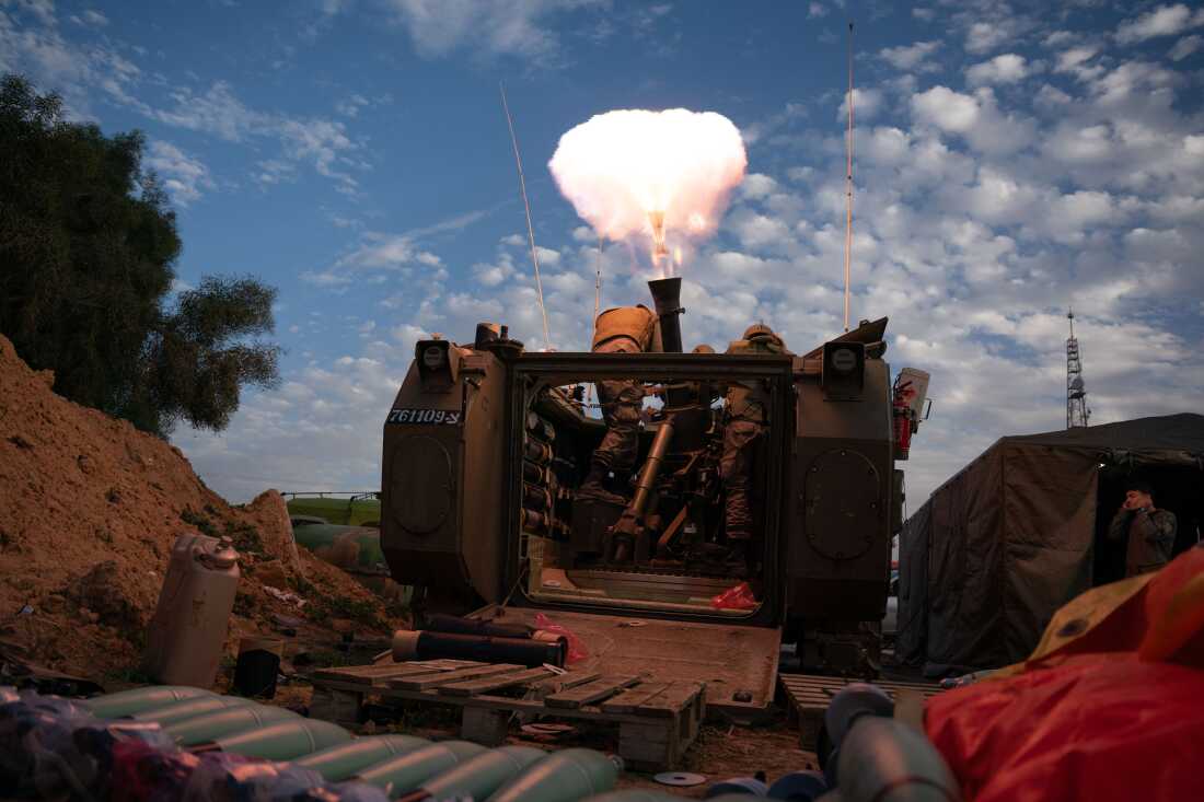 Israeli soldiers prepare and fire mortars from inside Israel into Gaza, backing up troops near the Maghazi refugee camp, where three attacks occurred that killed a combined 21 Israeli soldiers, on Jan. 22.