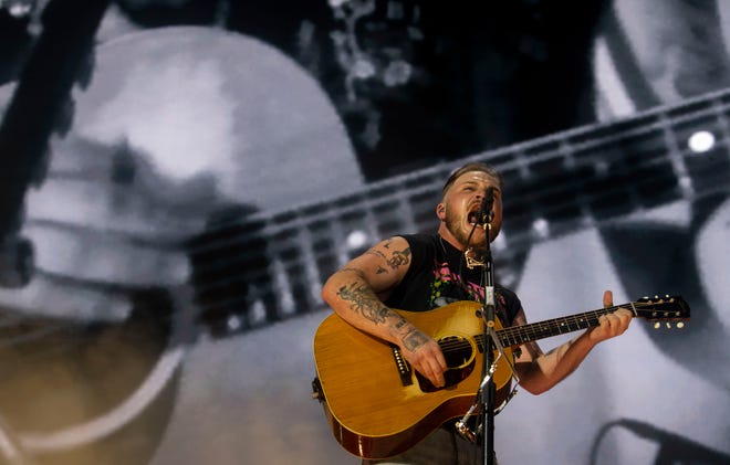 Zach Bryan is shown performing June 29 at Nissan Stadium in Nashville.