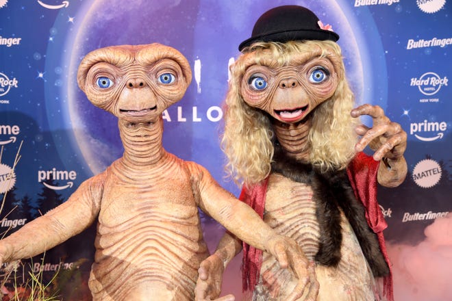 Tom Kaulitz and Heidi Klum, both dressed as E.T., attend Heidi Klum's 23rd annual Halloween party — presented by Butterfinger, Mattel, and Prime Video — at The Venue on Music Row on Oct. 31, 2024, in New York City.