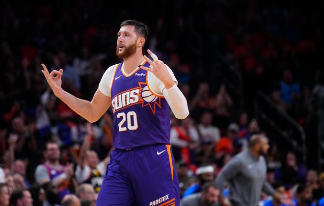 Suns center Jusuf Nurkic (20) celebrates a Kevin Durant three-pointer against the Mavericks during the home opener at the Footprint Center in Phoenix on Oct. 26, 2024.