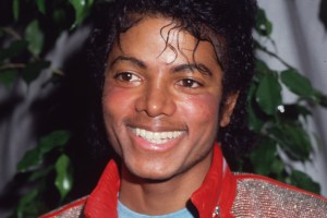 1983:  Portrait of American pop star Michael Jackson wearing a red leather jacket at the opening of the stage musical, 'Dream Girls,' Los Angeles, California.  (Photo by Frank Edwards/Fotos International/Getty Images)