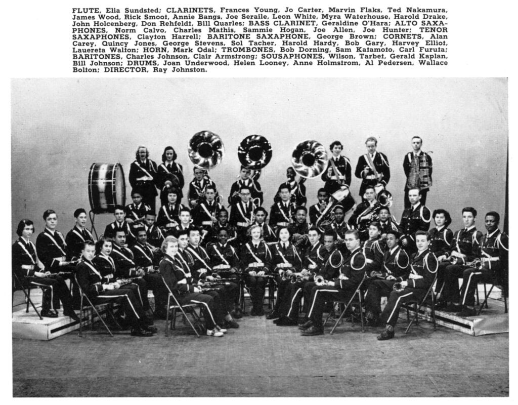 Quincy jones sits with a trumpet in Garfield's pep band.