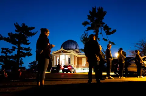 Stephen Maturen/Getty Images Voters line up outside a polling place at the Cincinnati Observatory on 5 November 2024 in Cincinnati, Ohio