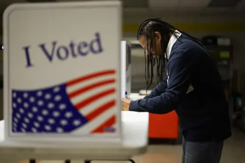 Quinn Glabicki/Reuters A man votes in the 2024 presidential election on Election Day, at Pittsburgh Manchester School in Pittsburgh, Pennsylvania, 5 November 2024 