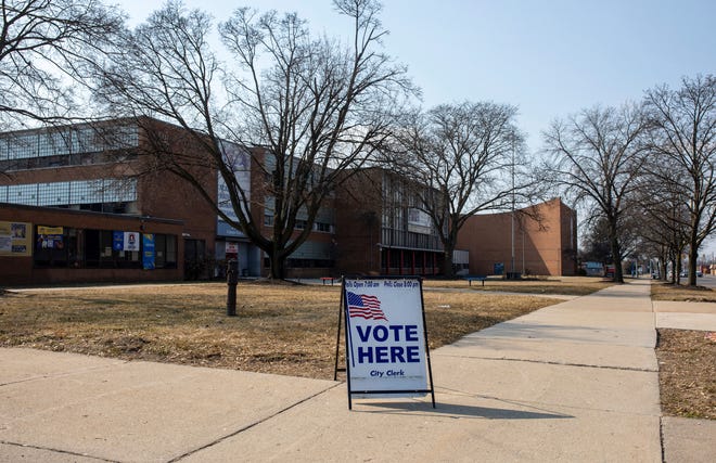 A vote here sign rests outside Osborn High School's polling place during the presidential primary in Detroit on Tuesday, Feb. 27, 2024.