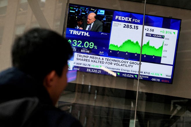 A screen displays trading information about shares of Truth Social and Trump Media & Technology Group, outside the Nasdaq Market site in New York City, U.S., March 26, 2024.