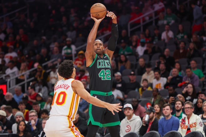 Nov 4, 2024; Atlanta, Georgia, USA; Boston Celtics center Al Horford (42) shoots against the Atlanta Hawks in the first quarter at State Farm Arena. Mandatory Credit: Brett Davis-Imagn Images