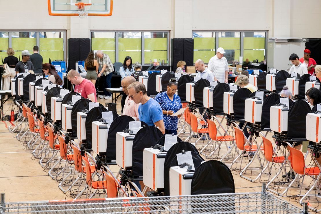 Voters cast their ballots during early voting at a polling location in Houston on October 25, 2024.