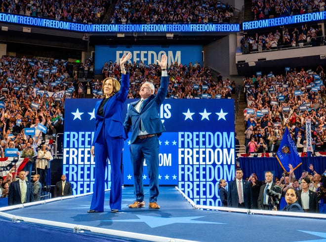 Democratic presidential nominee Kamala Harris and her running mate, Minnesota Gov. Tim Walz, campaign on Aug. 20, 2024, in Milwaukee, Wis.