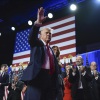 Republican presidential nominee former President Donald Trump waves as he walks with former first lady Melania Trump at an election night watch party at the Palm Beach Convention Center, Wednesday, Nov. 6, 2024, in West Palm Beach, Fla. 