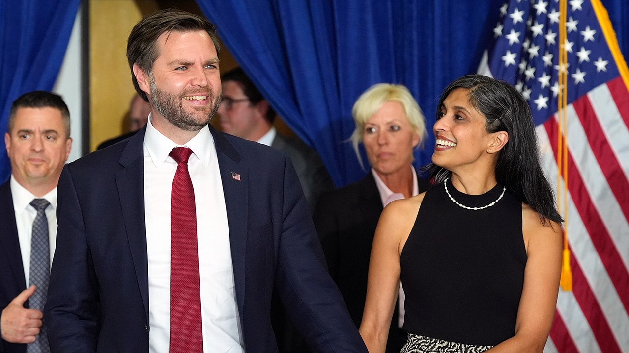 Sen. JD Vance, R-Ohio, is joined by his wife Usha Vance, right, as they arrive for a campaign rally, Saturday, Nov. 2, 2024, in Scottsdale, Ariz.