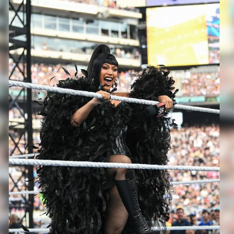Cardi-B-Stuns-in-Custom-Black-Feather-Corset-Dramatic-Cape-and-Le-Silla-Boots-for-WWE-Performance-of.jpeg